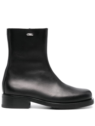 Our Legacy Camion boots in black calf leather with square toe and Vibram® sole. A modern essential, available at our Lisbon store.