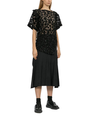 Junya Watanabe black flared wrap midi skirt with pleats and panelled A-line silhouette — available at our Lisbon store.
