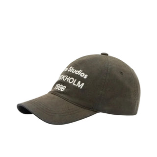 Logo-embroidered cap from Acne Studios. Cotton construction with adjustable back strap and iconic embroidered 1996. Available at our Lisbon store.