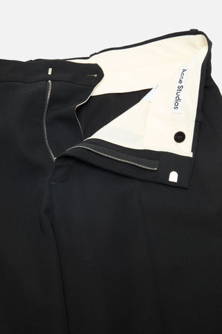 Acne Studios trousers with zip fly and hook-bar fastening. Features slant pockets and leather logo patch.  Available at our Lisbon store.