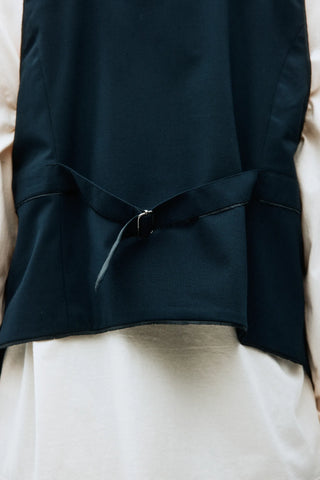 Adnym Athletics Gimey Vest, longer front, raw seam details, and a slim fit for a modern utility in navy viscose-blend fabric. Available at our Lisbon store. 