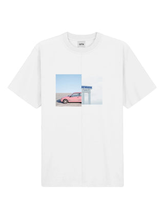 White short-sleeve t-shirt with a graphic of a pink car and blue sky by Arte Antwerp. 