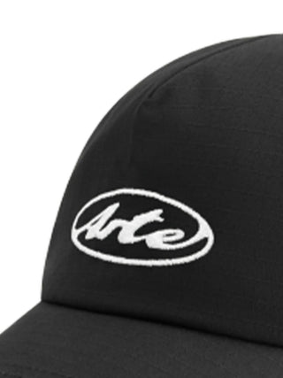 Black cap with a white logo by Arte Antwerp