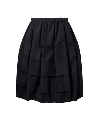 BLACK Comme des Garçons raw-edge layered skirt. Raw edge detailing and an elasticated drawstring waist. A mid-length piece in 100% polyester.