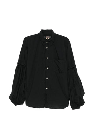 Black Comme des Garçons black balloon-sleeve shirt with button fastening and chest pocket. A modern statement piece, available at our Lisbon store.
