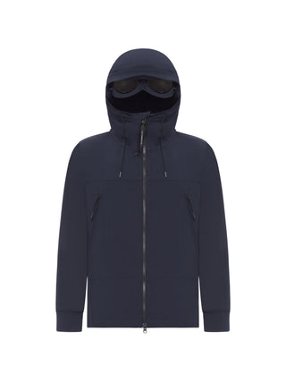 C.P. Company Shell-R Goggle jacket in blue with hood detail, zip fastening and pockets. A technical essential, available at our Lisbon store.