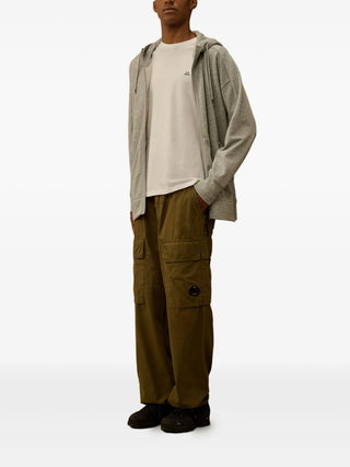 C.P. Company beige cotton T-shirt with logo patch and crew neck. A refined everyday essential, available at our Lisbon store.
