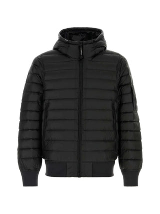 C.P. Company black hooded down jacket with padded design, zip fastening and side pockets. A winter essential, available at our Lisbon store.