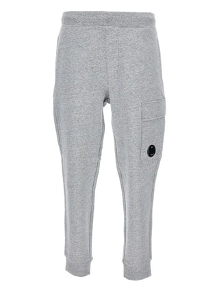 C.P. Company grey cotton cargo sweatpants with lens detail and drawstring waist. Relaxed fit, available at our Lisbon store.