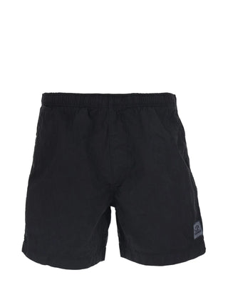The C.P. Company logo-patch swim shorts in versatile black
