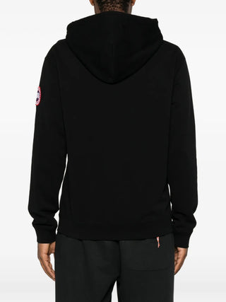 Loon logo-patch hoodie by Canada Goose. Organic cotton jersey with a double-lined hood, ribbed trims, and signature Arctic Program patch. 