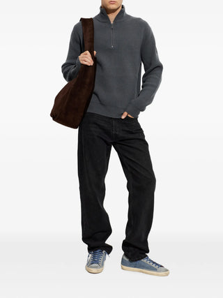 Canada Goose McKinney 1/4 Zip Knit. Crafted from extrafine merino wool with an English rib stitch. Signature tonal Disc patch and sculptural warmth.