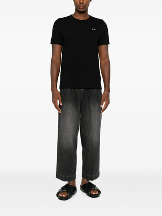 Comme des Garçons PLAY T-shirt with iconic heart patch embroidery. Pure cotton jersey with relaxed crewneck fit, heart-shaped logo with eyes at chest.