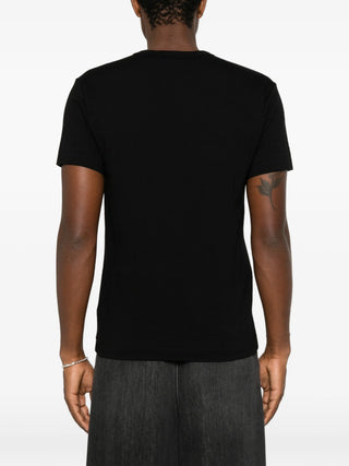 Comme des Garçons PLAY T-shirt with iconic heart patch embroidery. Pure cotton jersey with relaxed crewneck fit, heart-shaped logo with eyes at chest.
