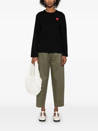 Comme des Garçons PLAY long-sleeve T-shirt with heart patch. Soft cotton jersey with extended sleeves for cooler weather. Available at our Lisbon store.