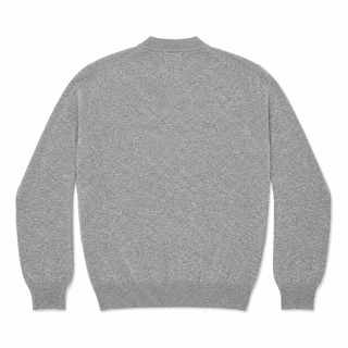 CDG PLAY round-neck cardigan in 100% wool. A unisex grey knit with a ribbed neckline and iconic heart patch, perfect for everyday layering. 