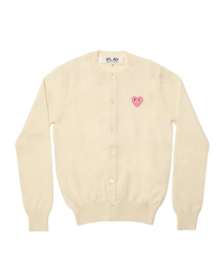 Comme Des Garçons PLAY round-neck cardigan in a neutral shade with the iconic heart emblem. A classic 100% wool knit with front button closure.