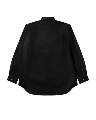 COMME DES GARÇONS SHIRT FOREVER wide-fit black shirt. Point collar, chest pocket, and curved hem. 100% cotton poplin. Available at our Lisbon store. 