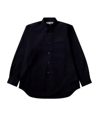 COMME DES GARÇONS SHIRT FOREVER wide-fit navy shirt. Point collar, chest pocket, and curved hem. 100% cotton. Available at our Lisbon store. 