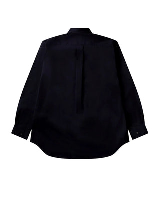 COMME DES GARÇONS SHIRT FOREVER wide-fit navy shirt. Point collar, chest pocket, and curved hem. 100% cotton. Available at our Lisbon store. 