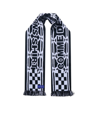 COMME DES GARÇONS SHIRT football scarf. A graphic spin on classic fan culture. Intarsia-knit design, bold lettering, and signature fringed edges.