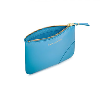 CDG colour-block zip wallet. Crafted from premium leather in a vibrant colour design, features a main compartment, card slots, and a secure top zip fastening.  