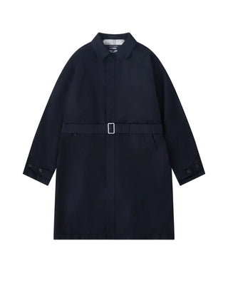 COMME DES GARÇONS HOMME black belted car coat. Signature detailing and impeccable craftsmanship. A timeless investment piece, available at our Lisbon store. 