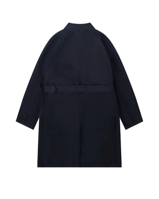 COMME DES GARÇONS HOMME black belted car coat. Signature detailing and impeccable craftsmanship. A timeless investment piece, available at our Lisbon store. 