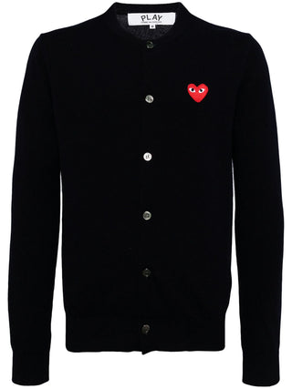 PLAY cardigan by Comme des Garçons featuring iconic heart motif. Pure wool knit in a classic silhouette. Button-front with ribbed trims and signature patch.