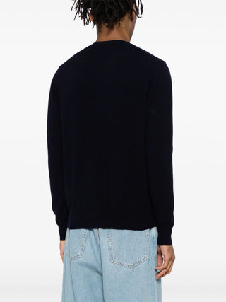 PLAY cardigan by Comme des Garçons featuring iconic heart motif. Pure wool knit in a classic silhouette. Button-front with ribbed trims and signature patch.