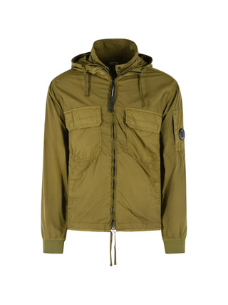 CP Company green medium jacket with drawstring hood, lens detail and utility pockets. Technical outerwear, available at our Lisbon store.