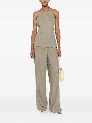 Calvin Klein Collection Erin brown halterneck top with open back and tie fastening, available at our Lisbon store.
