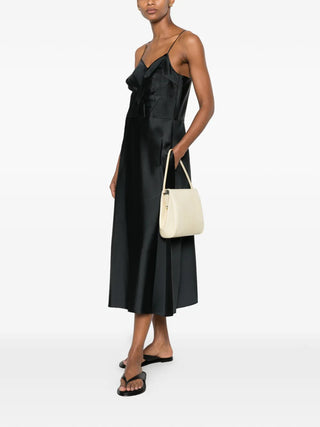 Calvin Klein Collection Fia black satin dress with V-neck and A-line skirt, available at our Lisbon store.