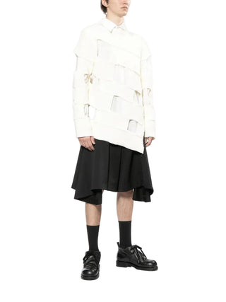Comme des Garçons Homme Plus white puffy pocket shirt with long sleeves and tailored fit. Modern essential, available at our Lisbon store.