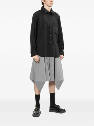 Comme des Garçons Homme Plus black puffy pocket shirt with long sleeves and button fastening. Tailored and modern, available at our Lisbon store.