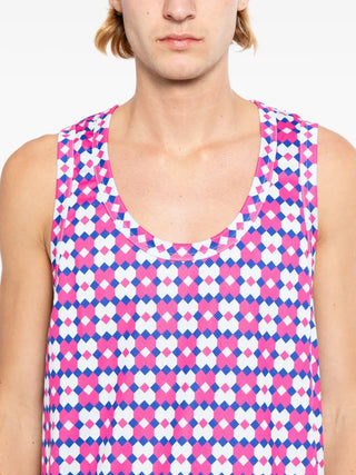 Comme des Garçons Homme Plus fuchsia pink patterned top with crew neck. Bold layering piece, available at our Lisbon store.