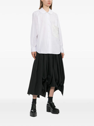 Comme des Garçons white shirt with lace pocket and round collar, available at our Lisbon store.