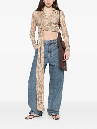 GANNI beige animal print tie waist shirt with long sleeves and button fastening. Flattering and versatile, available at our Lisbon store.