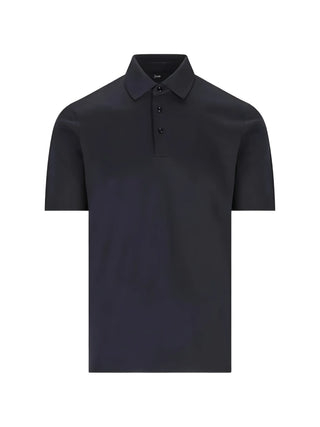 HERNO blue polo shirt with button closure and logo plaque. A refined everyday essential, available at our Lisbon store.