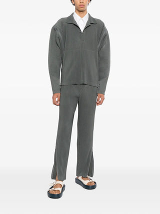 HOMME PLISSÉ ISSEY MIYAKE plissé zip-detail trousers. Signature pleats, elasticated waist, and multi-slider zip construction for customizable proportions.
