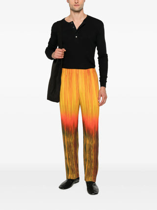 Homme Plissé Issey Miyake orange pleated trousers