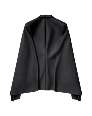JUNYA WATANABE cut-out sleeve blazer. Single-breasted, charcoal pinstripe wool, and asymmetric hem. Available at our Lisbon store. 