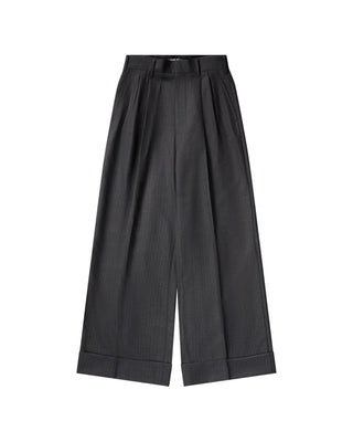 Pinstripe trousers by Junya Watanabe. Double front pleats, side slip pockets, and pre-cuffed hems. A refined loose-fit silhouette in wool. 