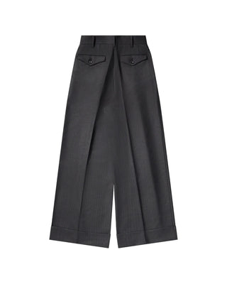 Pinstripe trousers by Junya Watanabe. Double front pleats, side slip pockets, and pre-cuffed hems. A refined loose-fit silhouette in wool. 