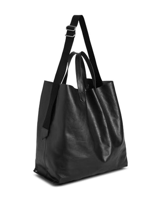 Jil Sander black embossed tote bag with adjustable strap, double handles and inner pocket. Functional design, available at our Lisbon store.