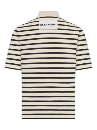 Black and white striped polo shirt with 'Jil Sander' branding on the back.