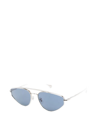 Jil Sander x Oliver Peoples TITANIO silver-tone geometric sunglasses with blue lenses. Lightweight and refined, available at our Lisbon store