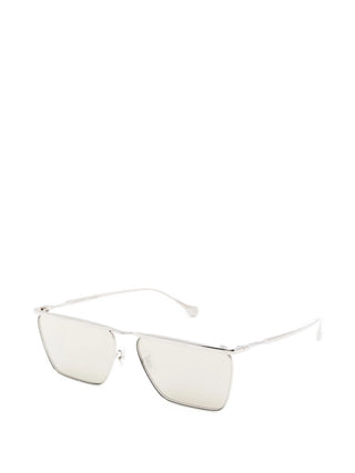 Jil Sander x Oliver Peoples TITANIO silver-tone rectangular sunglasses. Lightweight and minimal, available at our Lisbon store.