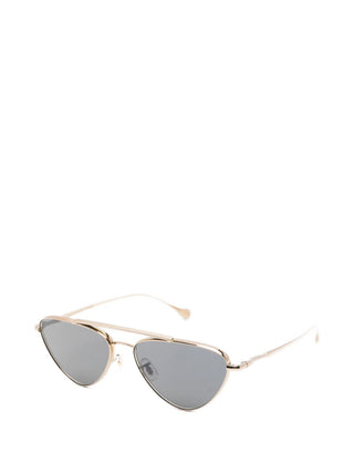 Jil Sander x Oliver Peoples gold-tone double-bridge sunglasses with tinted lenses. Lightweight and refined, available at our Lisbon store.