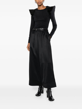 Junya Watanabe black T-shirt with sculptural shoulders and patent panels, available at our Lisbon store.